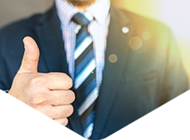 man in suit giving thumbs up